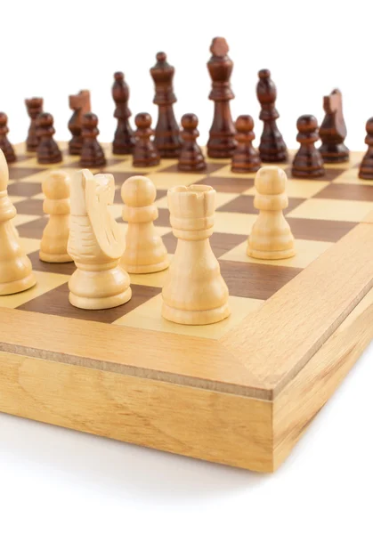 Chess figures on board at white — Stock Photo, Image