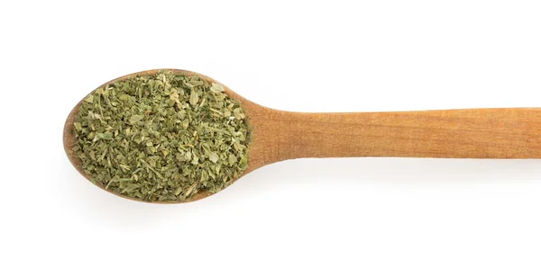 Torkade gröna kryddor och sked — Stockfoto