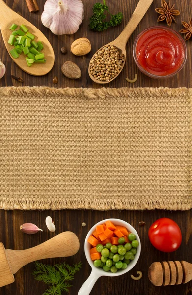 Herbs and spices on wood — Stock Photo, Image