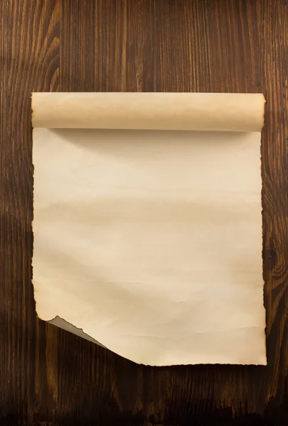 Parchment scroll on wood — Stock Photo, Image