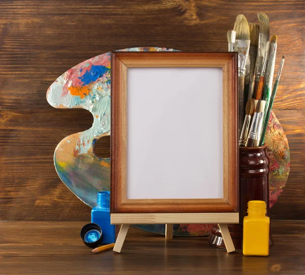 Picture frame and paints — Stock Photo, Image