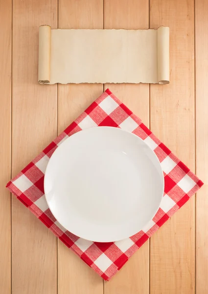 Plate and napkin on wood — Stock Photo, Image