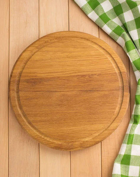 Napkin cloth and cutting board on wood — Stock Photo, Image