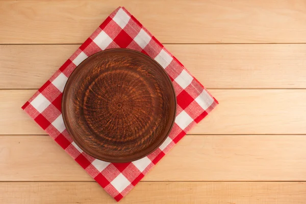 Kitchen utensils at cloth napkin on wood — Stock Photo, Image