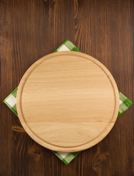 Napkin cloth and cutting board on wood — Stock Photo, Image