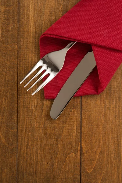 Knife and fork at napkin — Stock Photo, Image