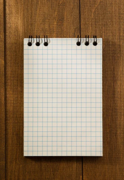 Notebook na dřevěné pozadí — Stock fotografie