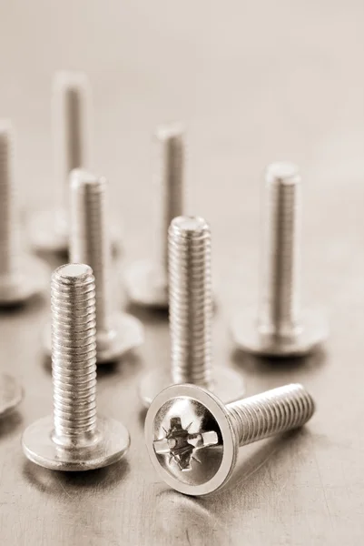 Bolts tool at metal background — Stock Photo, Image