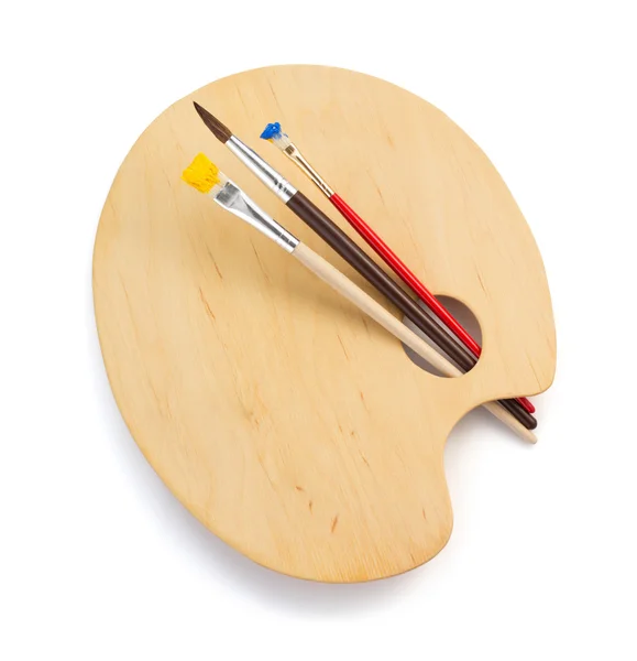 Wooden palette and paintbrush Stock Photo