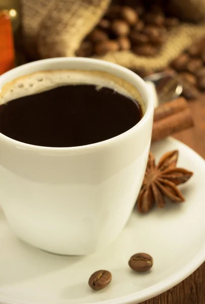 Cup of coffee with coffee beans — Stock Photo, Image