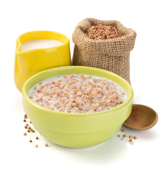 Buckwheat in bowl with milk — Stock Photo, Image