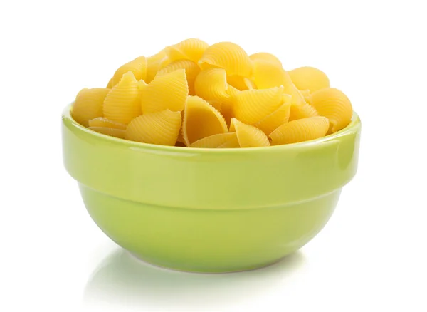 Raw pasta in bowl — Stock Photo, Image