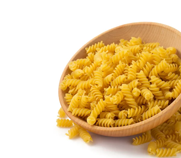 Pasta fusilli in wooden bowl — Stock Photo, Image