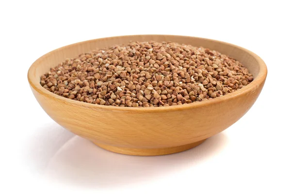 Raw buckwheat in bowl — Stock Photo, Image