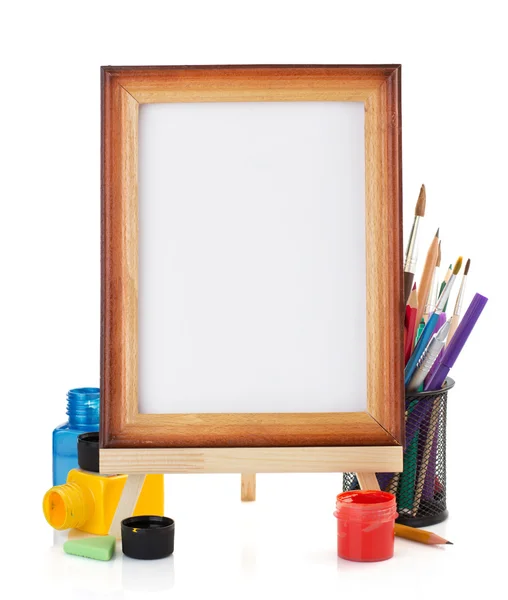 Paint supplies and frame — Stock Photo, Image