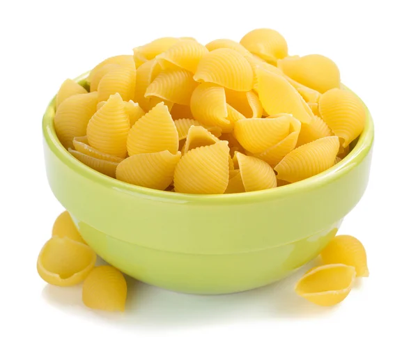 Raw pasta in bowl — Stock Photo, Image