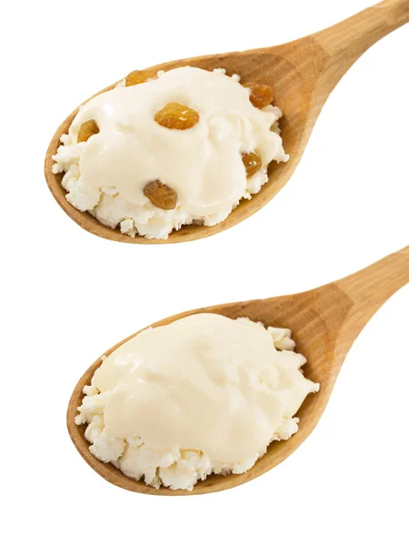 Cottage cheese and cream in spoons — Stock Photo, Image