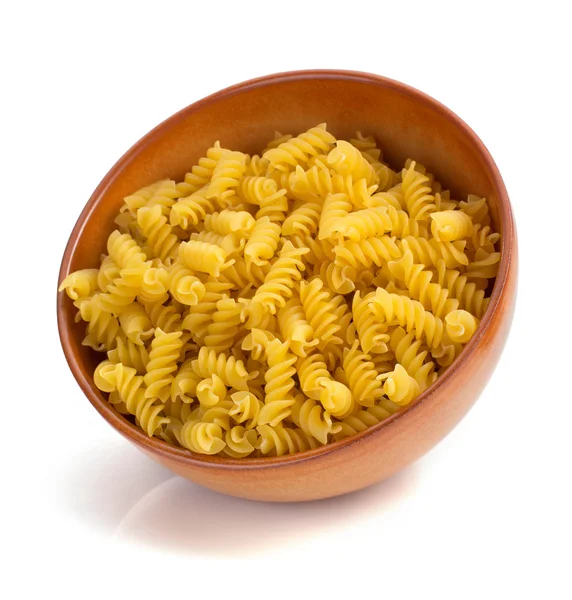 Pasta fusilli in wooden bowl — Stock Photo, Image
