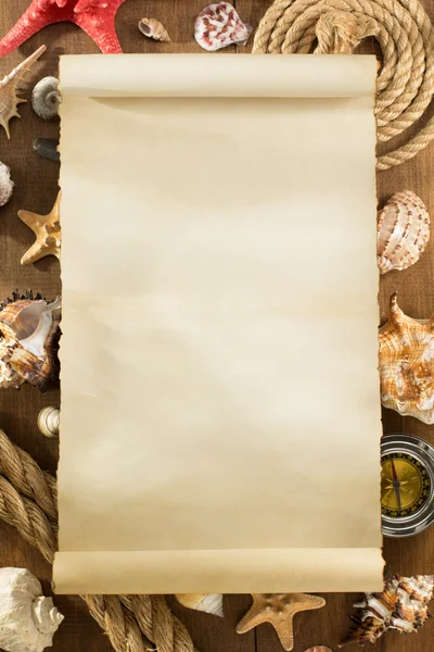 Old paper and seashell on wood — Stock Photo, Image