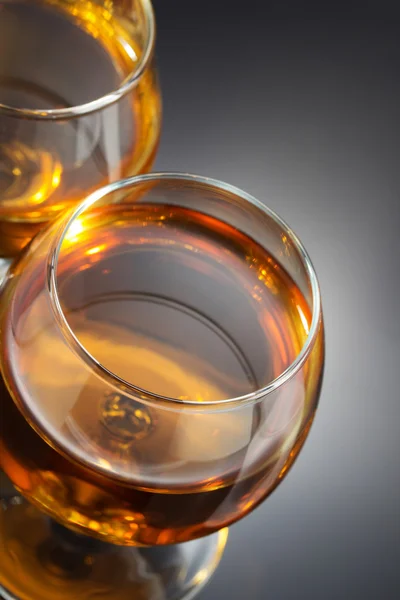 Cognac and  glass  on black — Stock Photo, Image