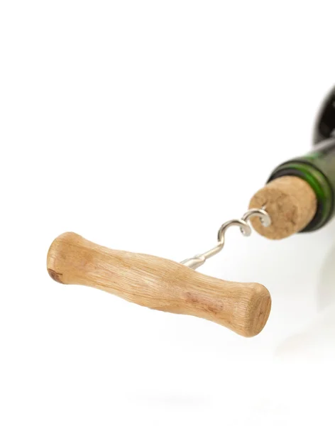 Corkscrew and wine bottle on white — Stock Photo, Image