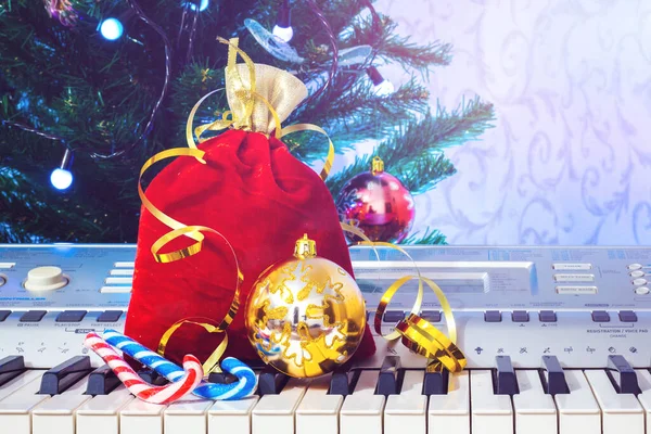 Christmas gifts near the piano. Music on New Year\'s night