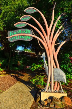 Tree signpost show the way to Kuranda town in Queensland Austral clipart