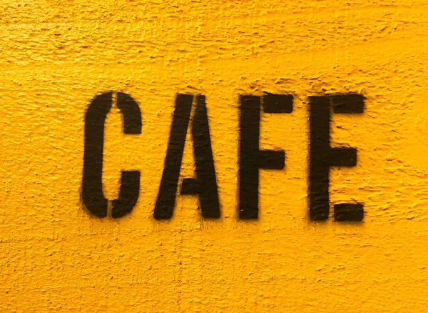 Cafe sign in black on yellow — Stock Photo, Image