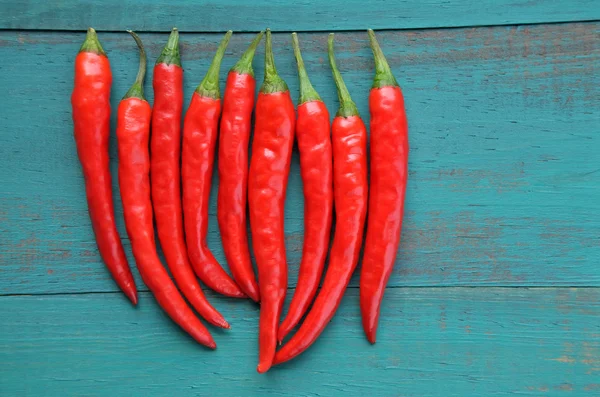 Flat lay view of hot red chili peppers — Stock Photo, Image