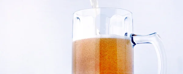 Pouring beer into a glass cup — Stock Photo, Image