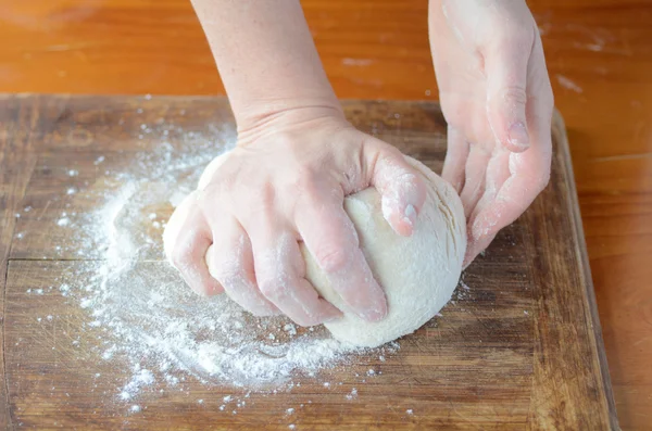 Woman hands kneading dough — Stock Photo, Image