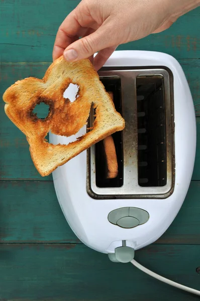 Flat lay view of hand holds one slices of toast bread — Stock Photo, Image