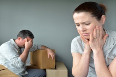 Sad evicted couple worried relocating house clipart