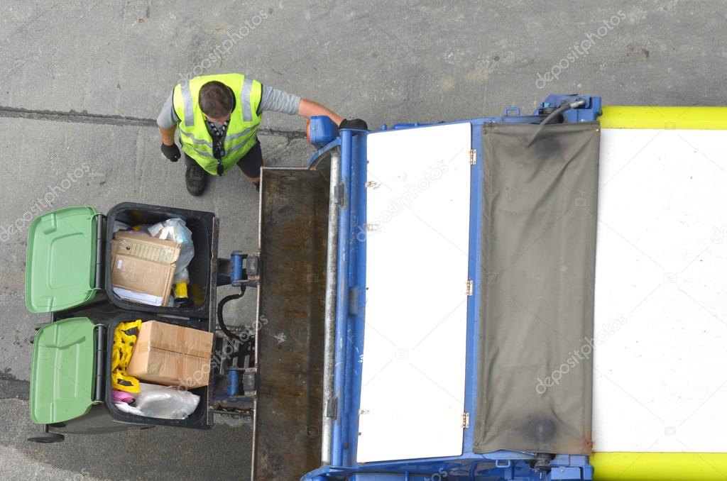 Garbage man loading garbage truck