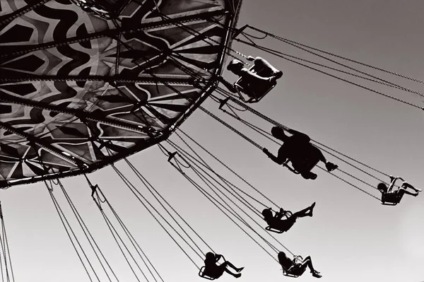 Silhouette People Riding Spinning Swing Carousel Amusement Park Low Wide — Stock Photo, Image