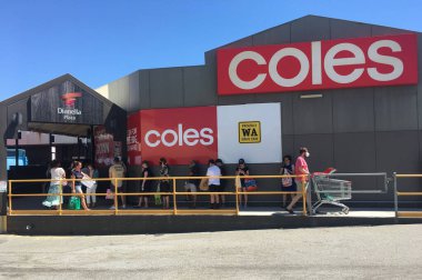 PERTH, WA - JAN 31 2021:Line of people outside Coles in Dianella Plaza.Panic buyers are stripping supermarkets of essential supplies after the WA Government announced a five-day lockdown. clipart