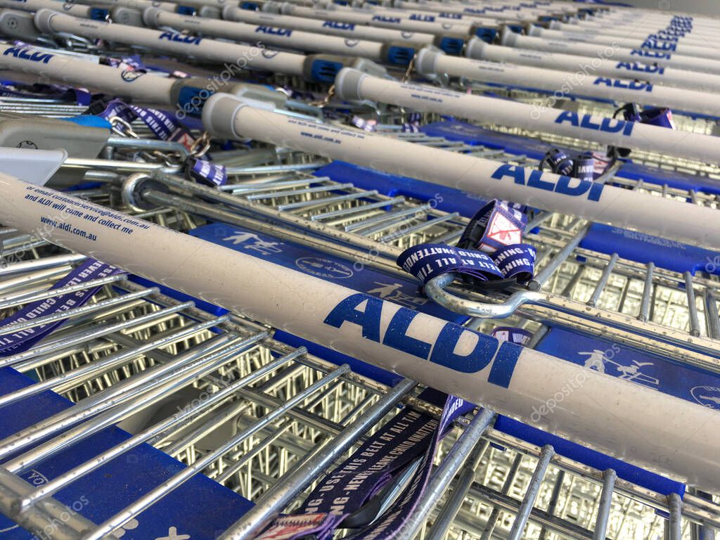 PERTH, WA - FEB 25 2021: Aldi supermarket shopping carts. Aldi is German family-owned discount supermarket chains with over 10,000 stores in 20 countries and combined turnover of more than 50 billion.