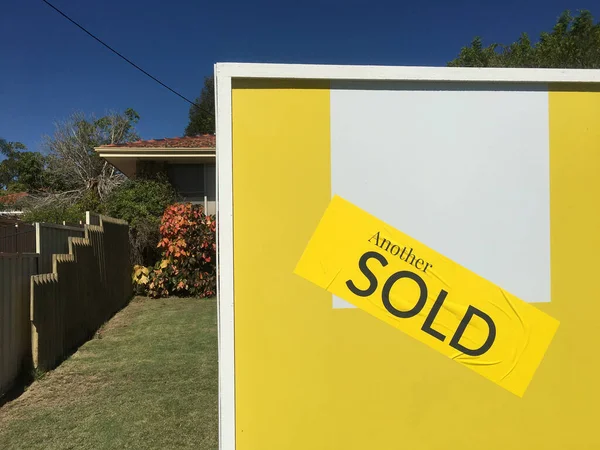 Large sold sign on home front yard. Real estate housing  property market concept. No people. Copy space