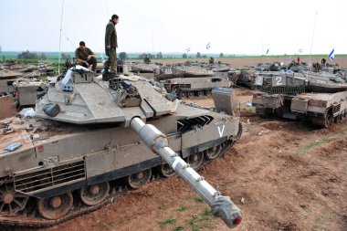 GAZA STRIP - NOV 19 2009:Israeli tank crew prepares for a land Incursion into Gaza Strip during Cast Lead operation.It was a three-week armed conflict in the Gaza Strip during the winter of 2008-2009. clipart