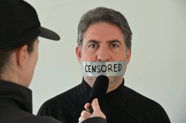 News reporter interviewing an eyewitness person that his information has being censored. clipart