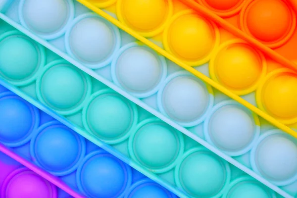 Spingere Pop Esso Bolla Fidget Giocattolo Sensoriale Colori Arcobaleno Sfondo — Foto Stock