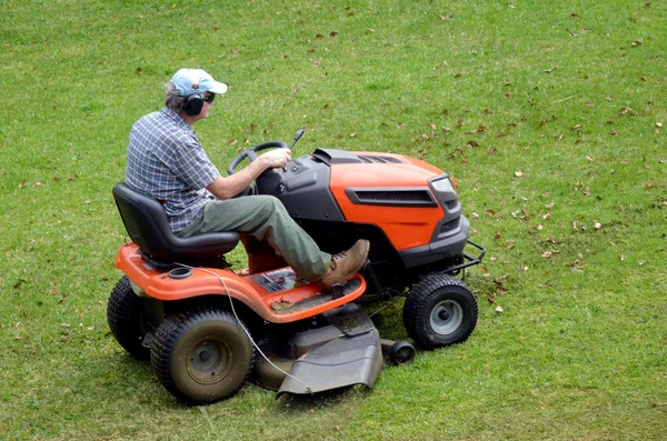 Gardner on ride-on lawn — Stock Photo, Image