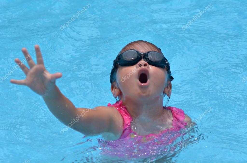 Drowning child in swimming pool Stock Photo by ©lucidwaters 59546541