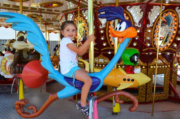 Girl ride on carousel — Stock Photo, Image
