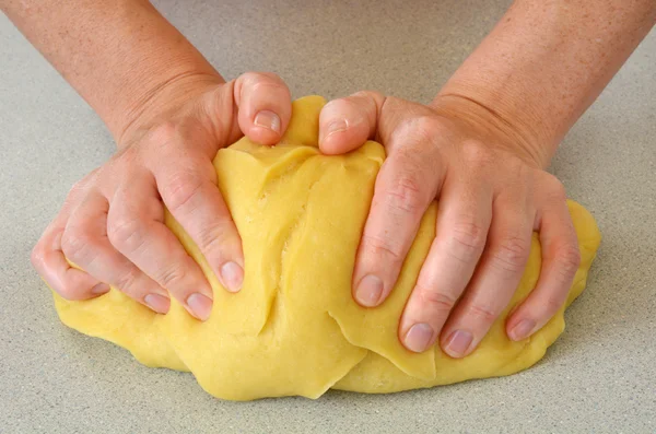 Woman hands kneading dough — Stock Photo, Image