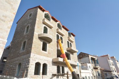 Jerusalem stone facade on Restored building clipart