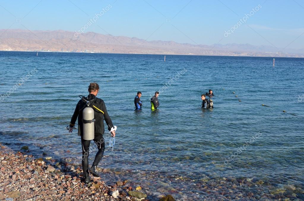 Divers in Coral Beach Nature in Israel – Stock Editorial Photo © lucidwaters #74367601
