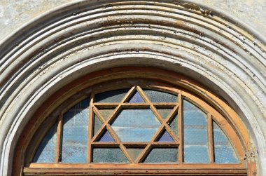 Star of David on a doorway of a synagog clipart