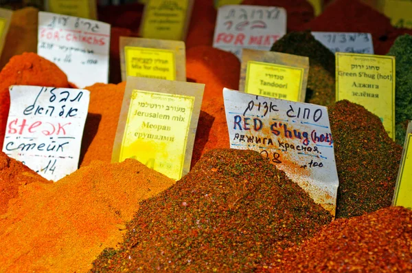 Variety of spices on display in food market — Stok fotoğraf