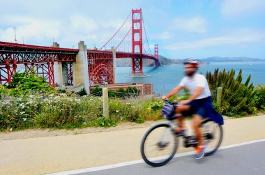 Cyclist in the Golden Gate Bridge in San Francisco, CA clipart